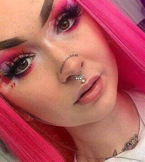 nose piercing with chain over.